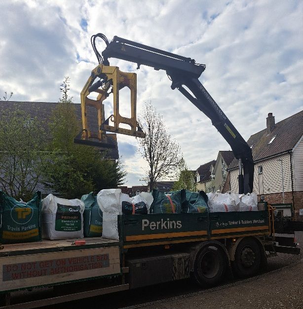 Lorry delivering loam and gravel